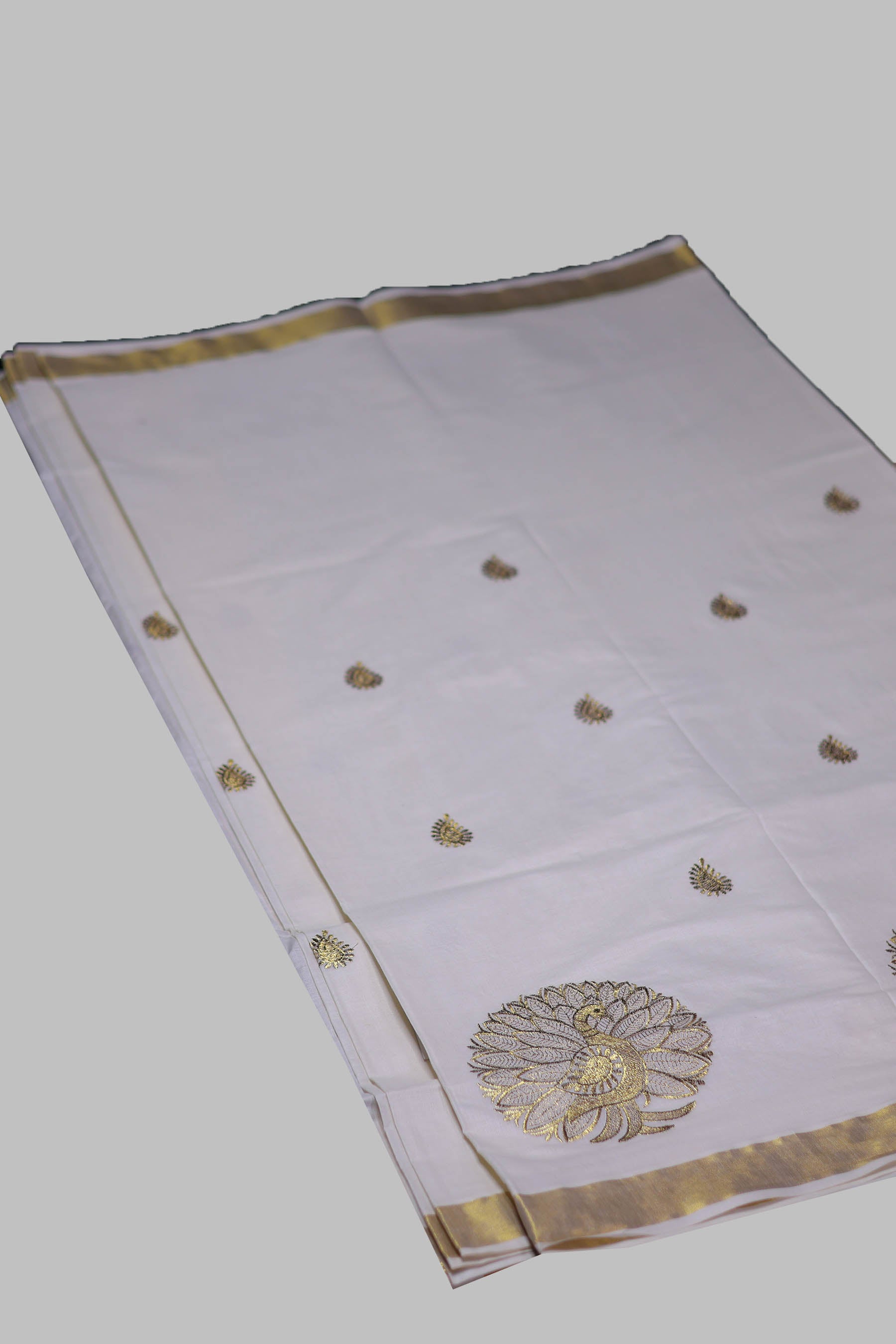 Elegant Kerala Cotton Saree with Peacock Motifs & Gold Zari Border Saree JCS Fashions