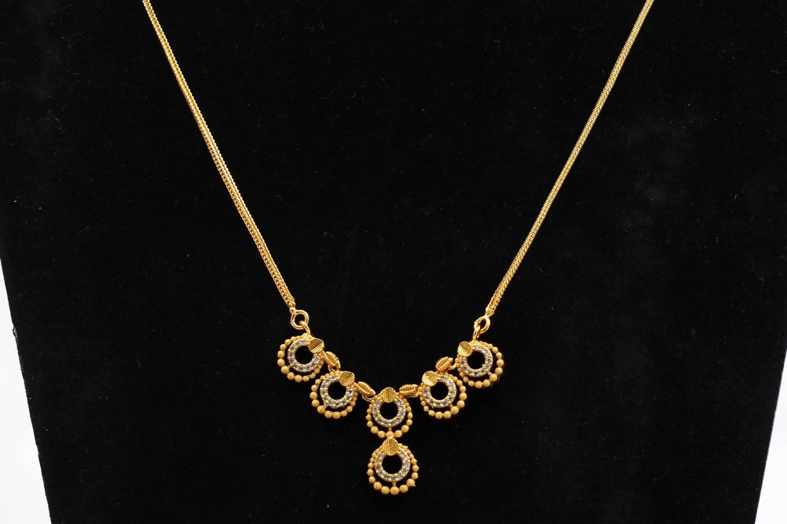 Regal Glamour: JCS Fashion Gold-Tone Chain with White Stone Pendant Jewelry JCS Fashions