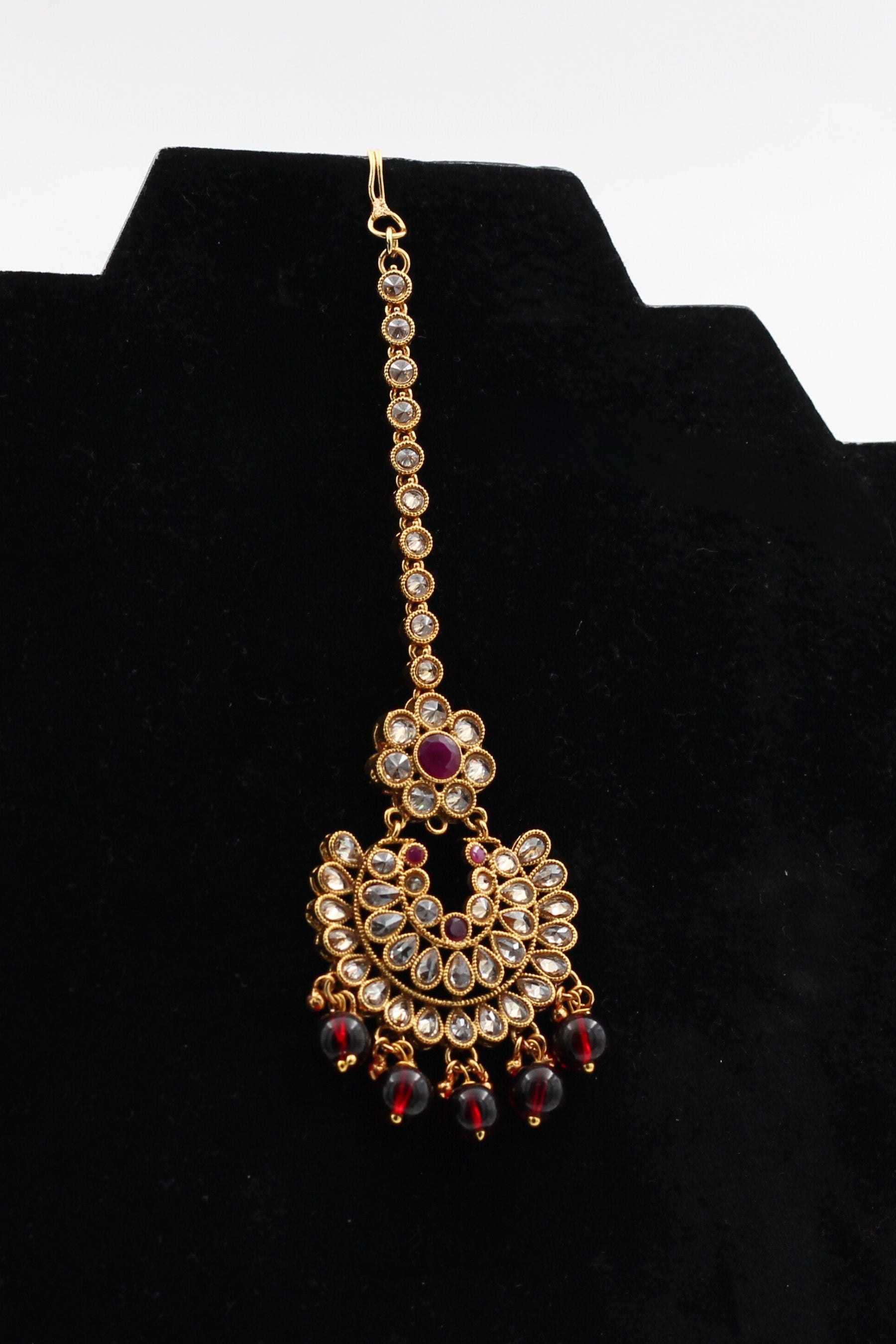 JCSFashions Gold-Polished Kundan Tikka with Elegantly Hanging Beads Jewelry JCS Fashions