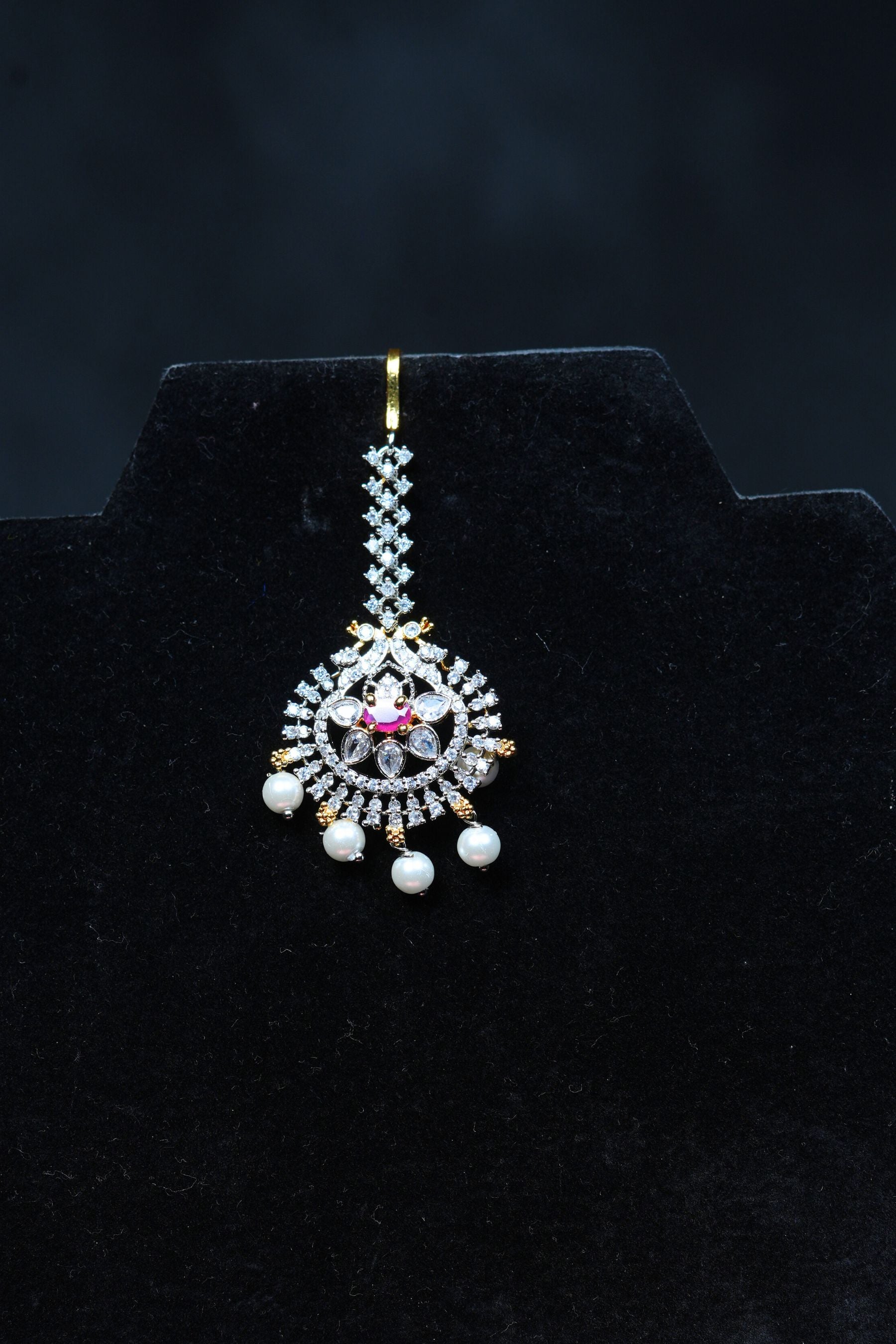 Radiant Elegance: Gold Polished Tikka with Sparkling AD Stones