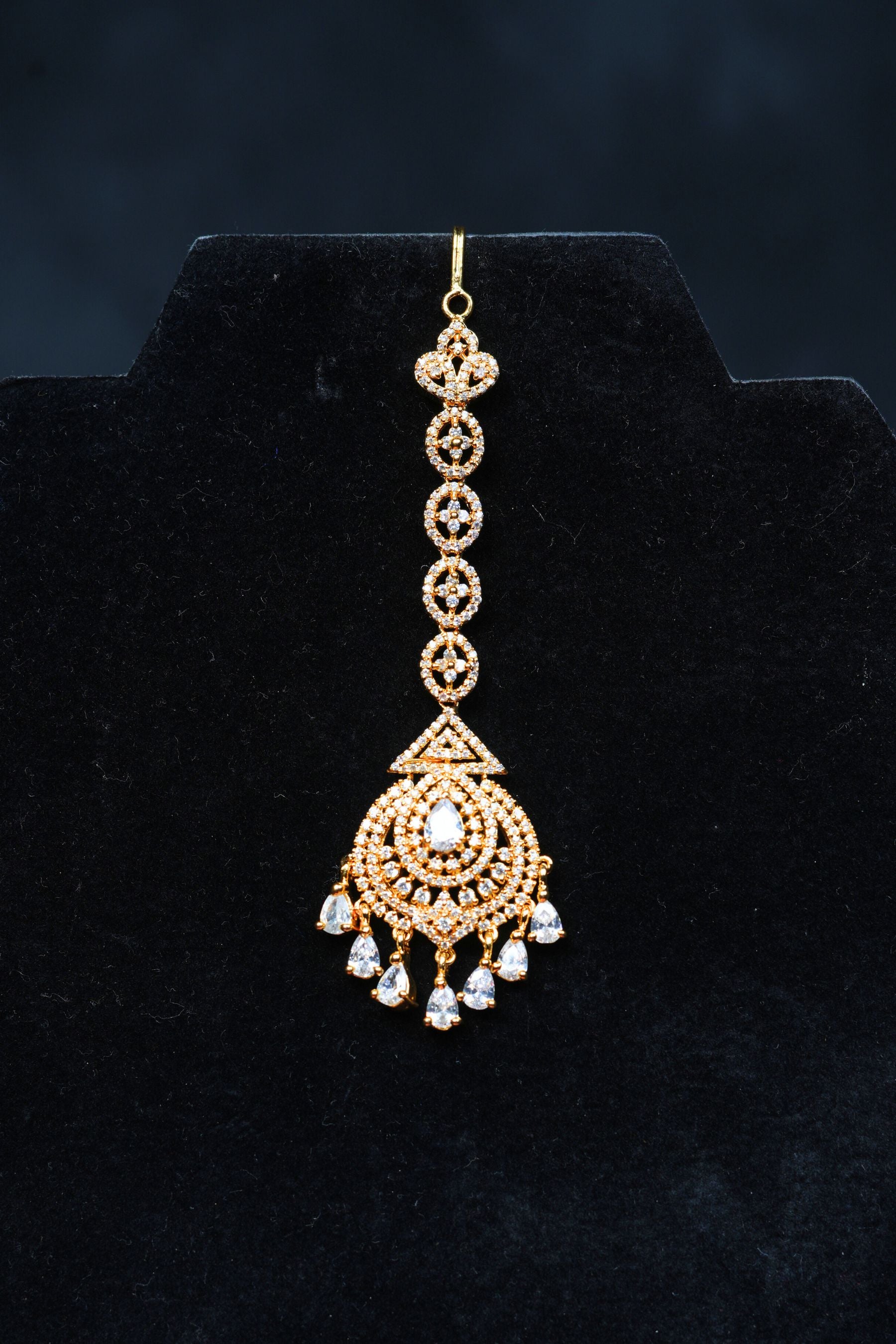 Glamour in Gold: AD Stone Tikka for Divine Elegance at JCSFashions