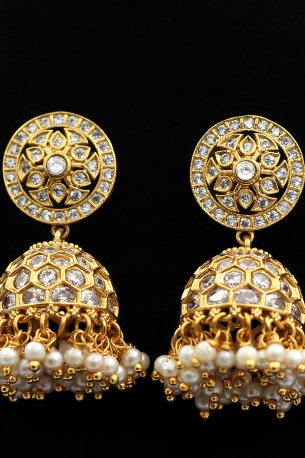 JCS Fashions' Gleaming Gold Jhumka Earrings with White Stones & Pearls