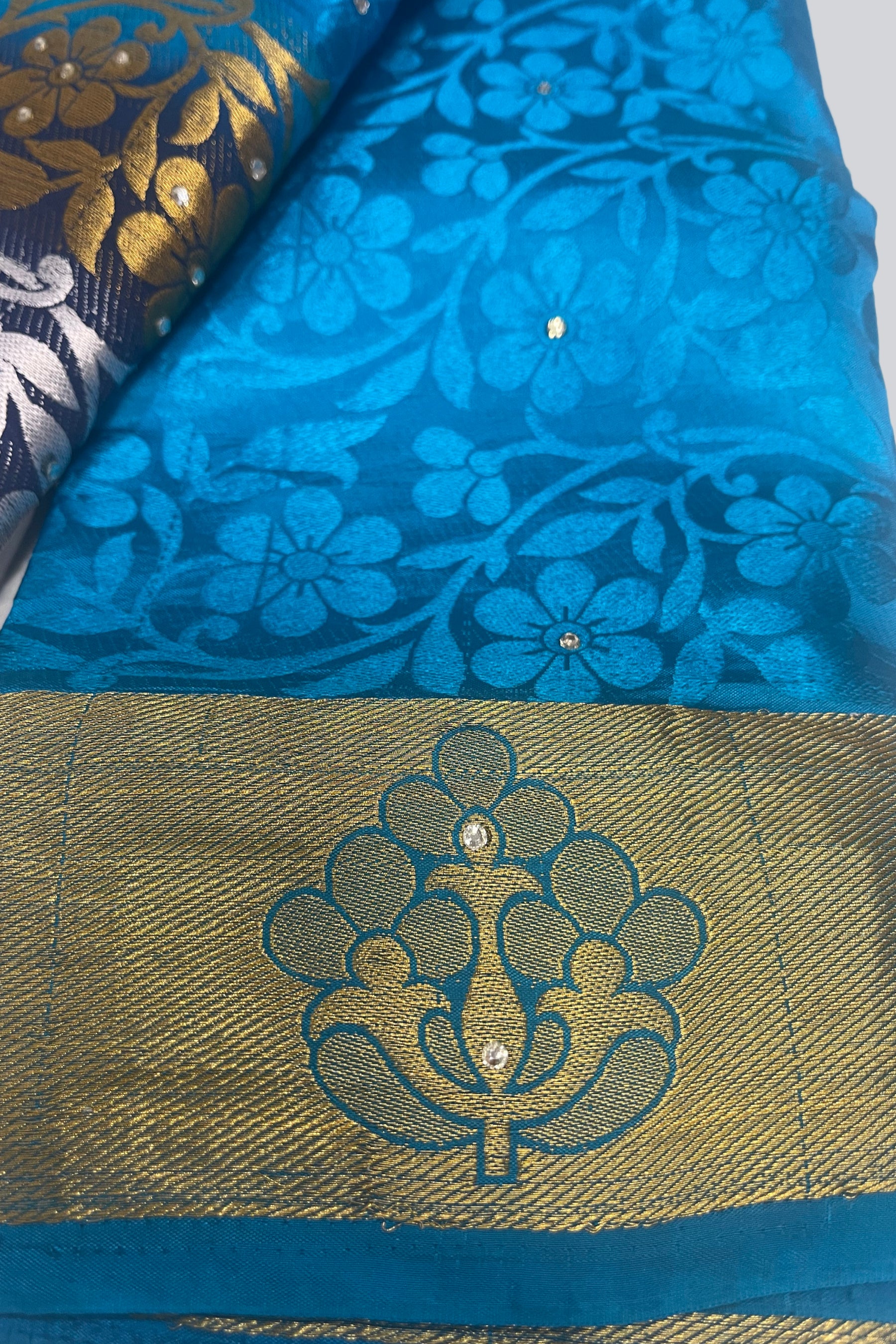 Radiant Charm: Embossed Silk Cotton Saree with Stunning Stone Work JCS Fashions